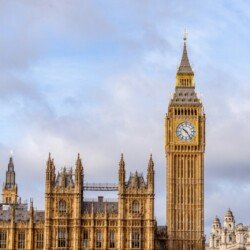 the big ben clock tower towering over the city of london
